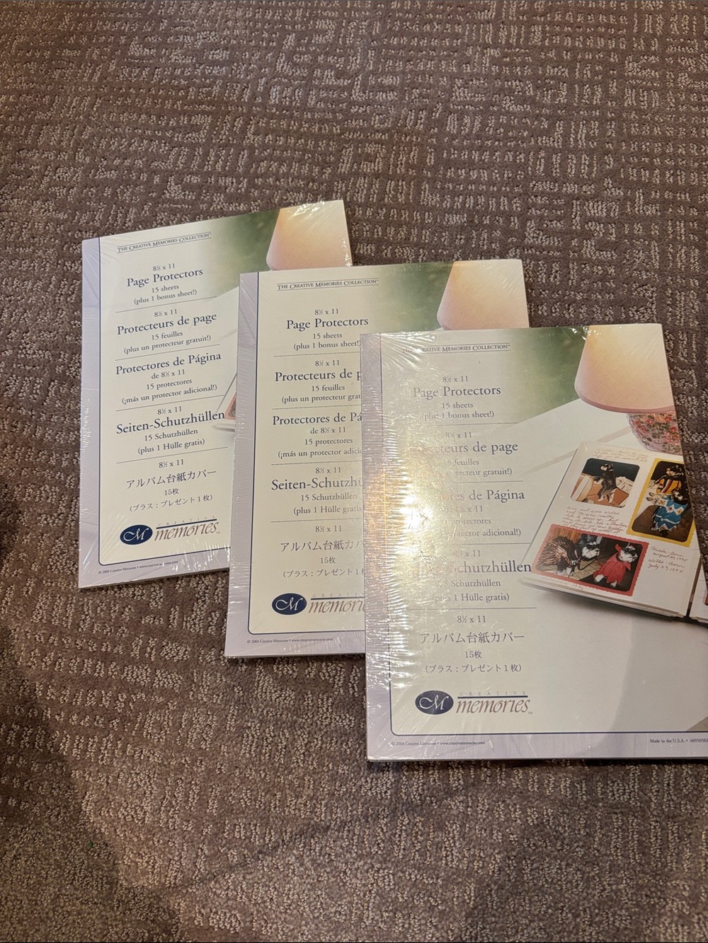 Three unopened packs of page protectors from creative memories, 8 1/2 x 11